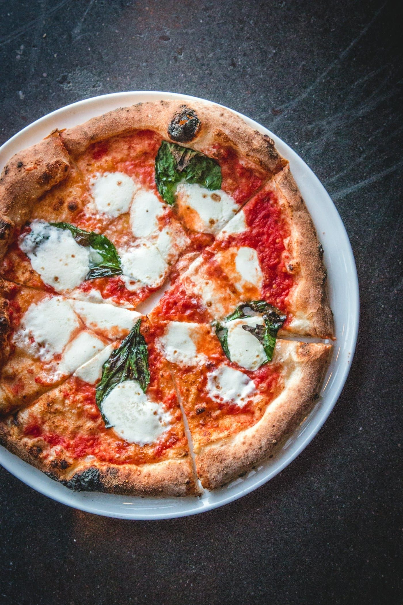 Pizza margherita fatiada (foto ilustrativa)